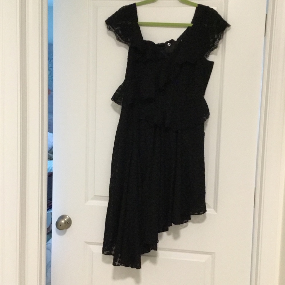 A Bardot Lace dress with a small pepsin waist